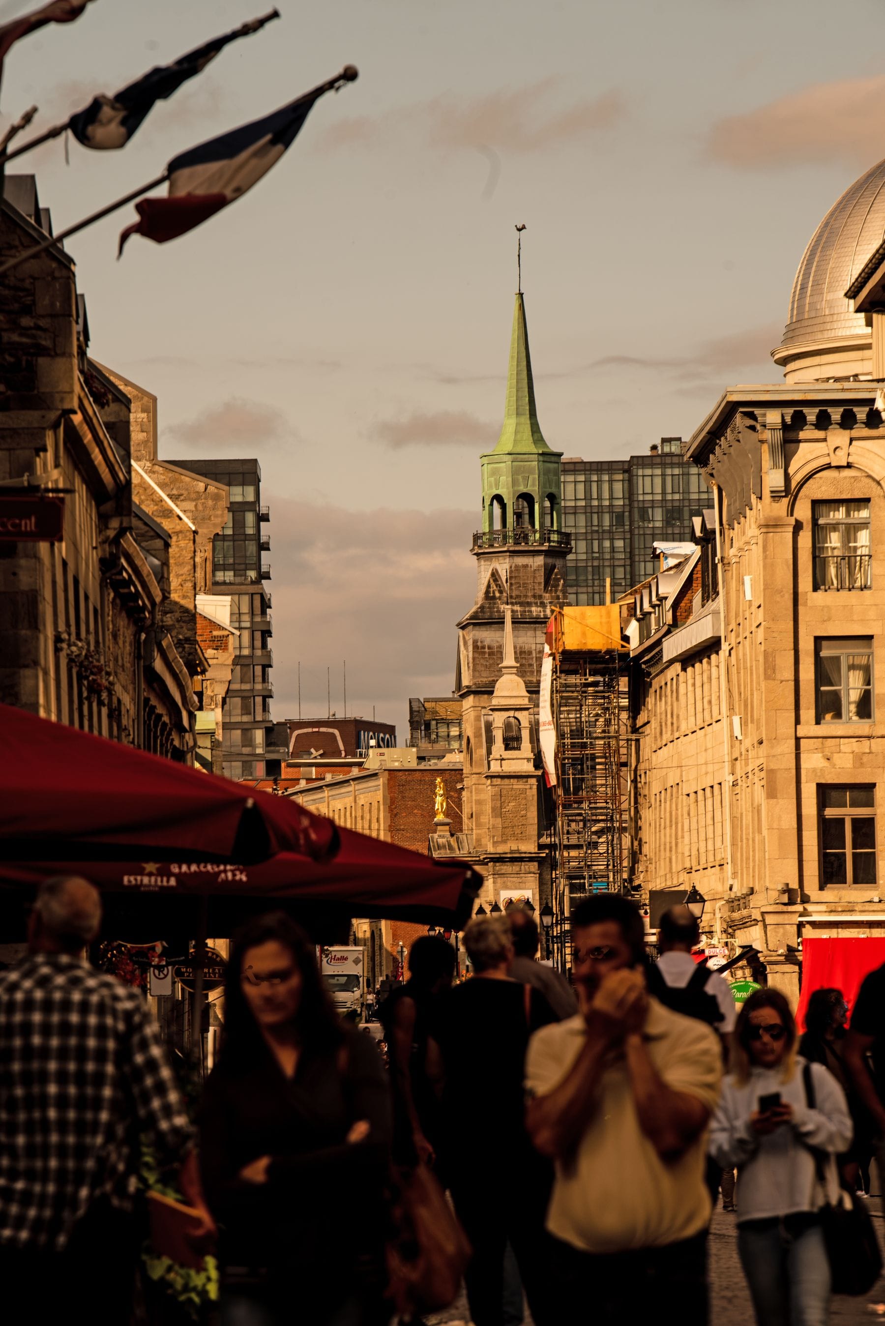 A crowded city street between traditional buildings