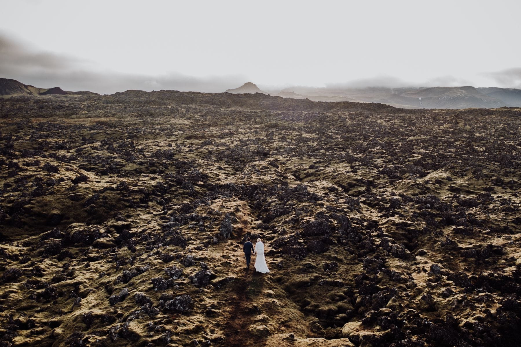 A couple walking through the desert