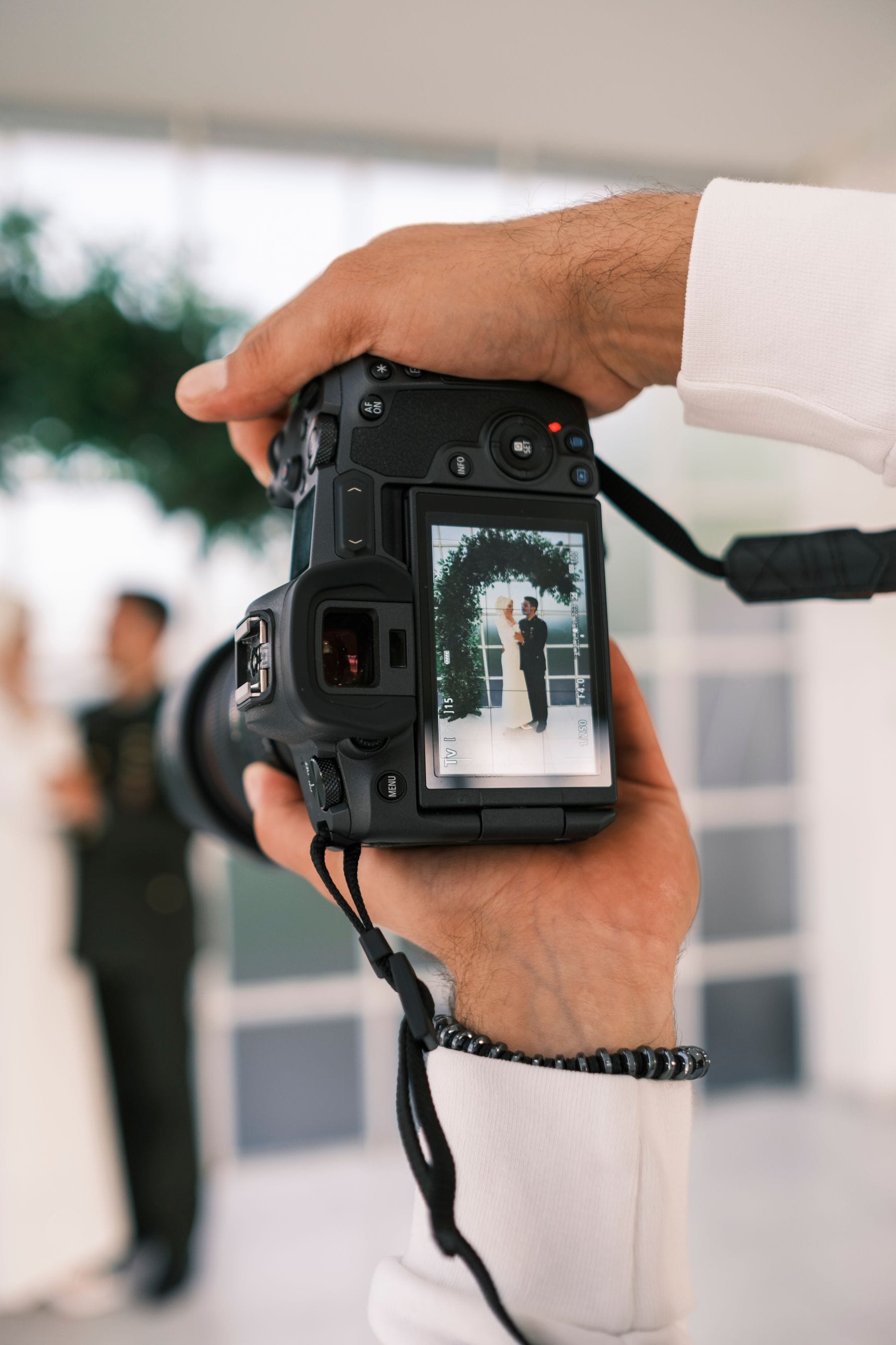 Close up of a viewfinder of a camera photographing couple