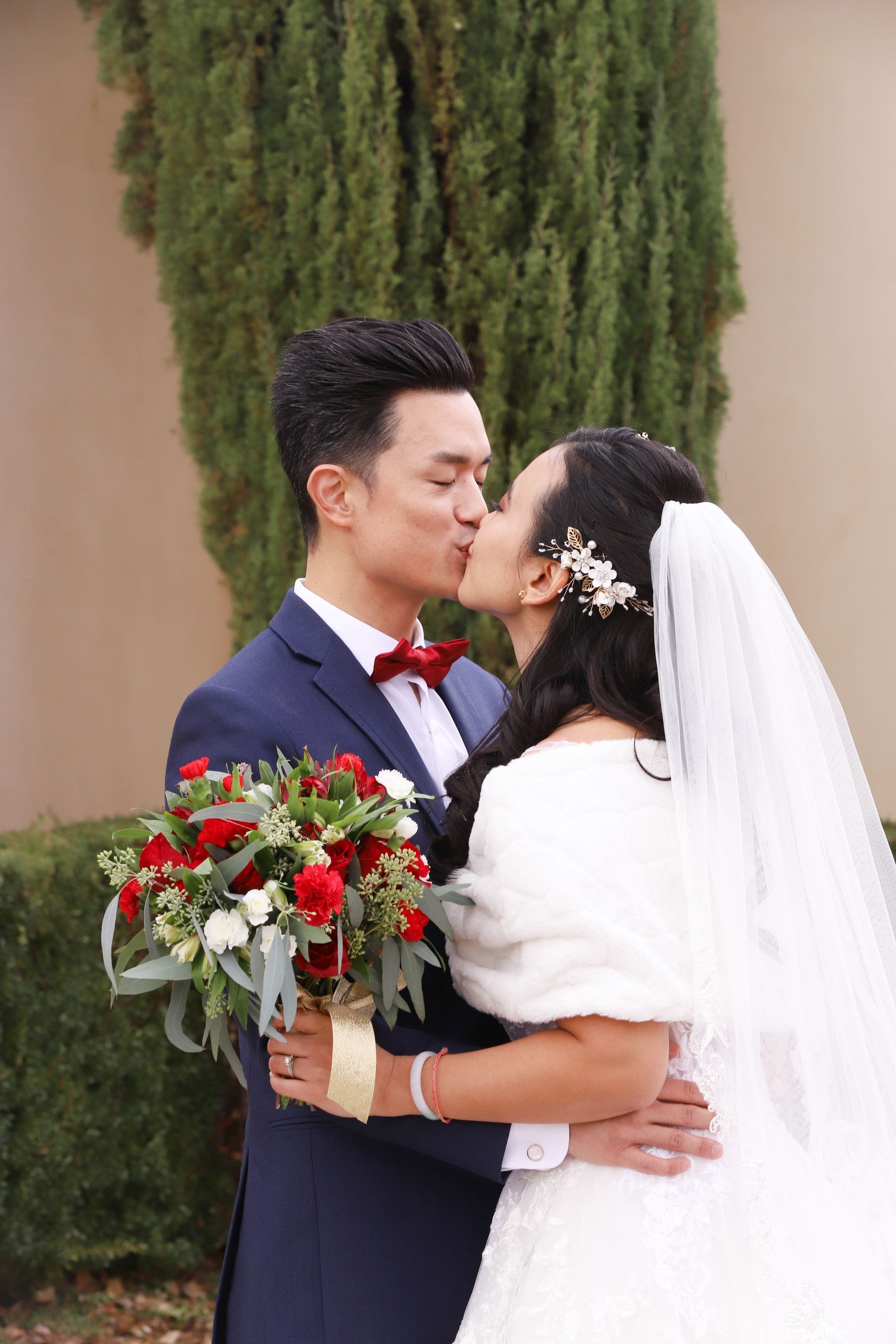 A first kiss at an outdoor ceremony