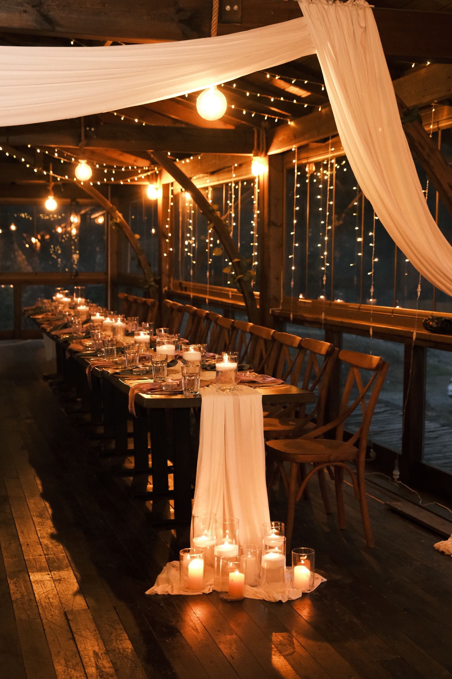 Elegant candlelit dinner setting with twinkle lights