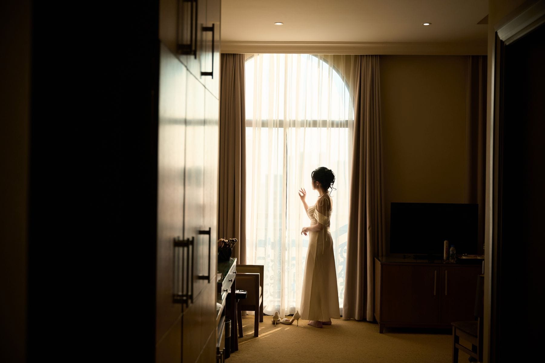Getting ready by a sunlit window